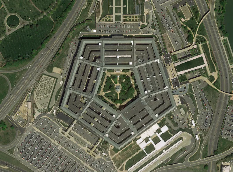 Satellite Imagery Intelligence overhead view of the Pentagon headquarters building and surrounding road networks and parking areas, representing government and defense intelligence operations at the highest levels of national security. Geospatial Intelligence and decision ready intelligence solutions supporting government and defense agencies are showcased through this iconic facility captured from satellite imagery.